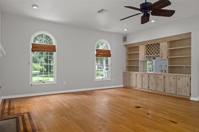 7268 Crystal Spring Run, Weeki Wachee, FL 34607 - unfurnished living room featuring light wood-style floors, ceiling fan, and recessed lighting
