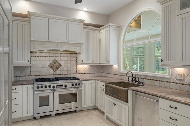 7268 Crystal Spring Run, Weeki Wachee, FL 34607 - kitchen featuring appliances with stainless steel finishes, light stone counters, tasteful backsplash, recessed lighting, and premium range hood