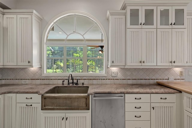 7268 Crystal Spring Run, Weeki Wachee, FL 34607 - kitchen featuring stainless steel dishwasher, decorative backsplash, white cabinets, and glass insert cabinets