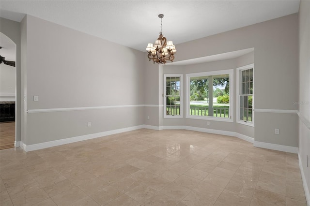 7268 Crystal Spring Run, Weeki Wachee, FL 34607 - spare room with a chandelier and ceiling fan
