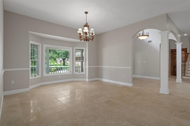 7268 Crystal Spring Run, Weeki Wachee, FL 34607 - unfurnished room featuring arched walkways, decorative columns, a chandelier, and light tile patterned floors