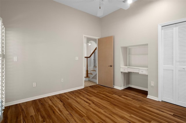 7268 Crystal Spring Run, Weeki Wachee, FL 34607 - unfurnished bedroom featuring wood finished floors, a closet, and a desk