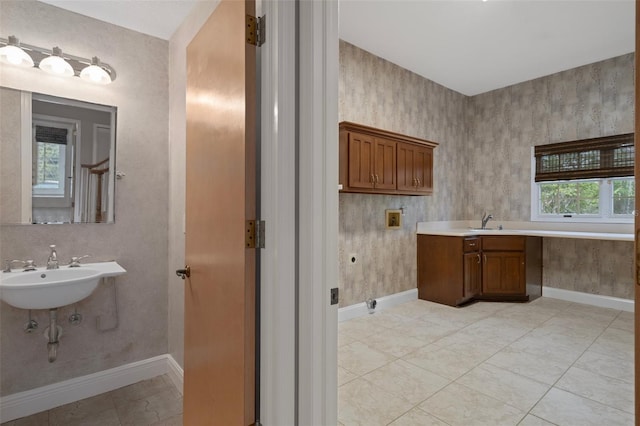 7268 Crystal Spring Run, Weeki Wachee, FL 34607 - bathroom featuring baseboards and a sink