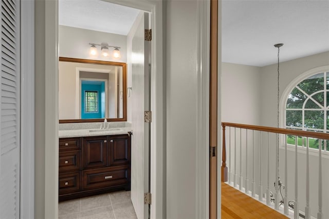 7268 Crystal Spring Run, Weeki Wachee, FL 34607 - bathroom with vanity, tile patterned floors, and a chandelier