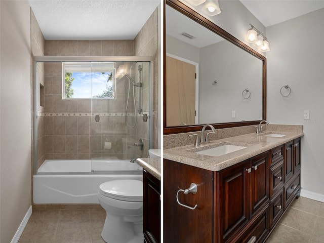 7268 Crystal Spring Run, Weeki Wachee, FL 34607 - bathroom featuring double vanity, tile patterned flooring, and shower / bath combination with glass door