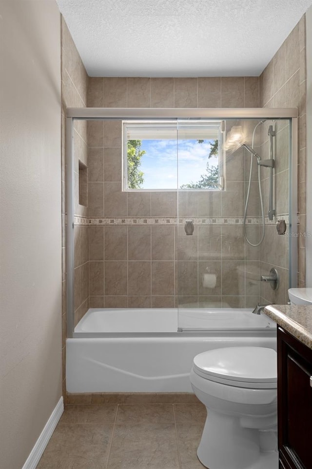7268 Crystal Spring Run, Weeki Wachee, FL 34607 - full bath featuring vanity, shower / bath combination, a textured ceiling, and tile patterned flooring