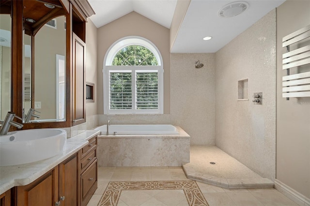 7268 Crystal Spring Run, Weeki Wachee, FL 34607 - full bath featuring tile patterned flooring, a bath, vanity, vaulted ceiling, and a shower
