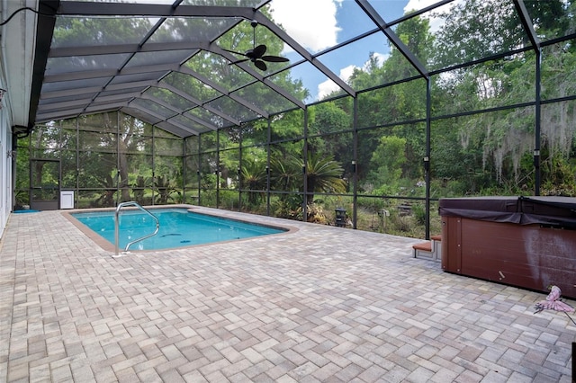 7268 Crystal Spring Run, Weeki Wachee, FL 34607 - outdoor pool featuring a hot tub, a patio, and a lanai