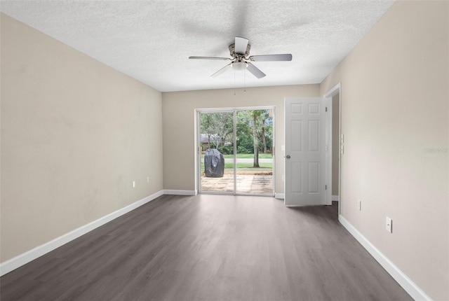 6509 Pine Meadows Dr, Spring Hill, FL 34606 - unfurnished room featuring dark wood-style floors, ceiling fan, and a textured ceiling