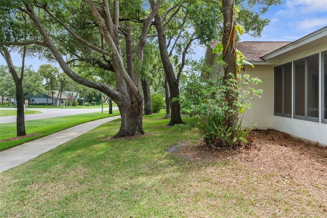 6509 Pine Meadows Dr, Spring Hill, FL 34606 - view of green lawn with a sunroom