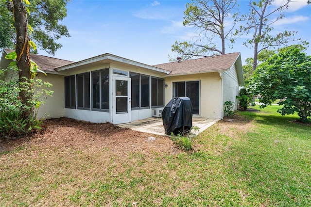 6509 Pine Meadows Dr, Spring Hill, FL 34606 - back of house featuring a sunroom, stucco siding, a lawn, and a shingled roof