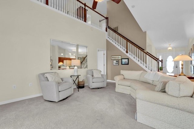 11418 Tee Time Cir, New Port Richey, FL 34654 - living area featuring stairs, carpet flooring, a high ceiling, and a ceiling fan