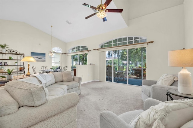 11418 Tee Time Cir, New Port Richey, FL 34654 - carpeted living room featuring high vaulted ceiling, a ceiling fan, and healthy amount of natural light