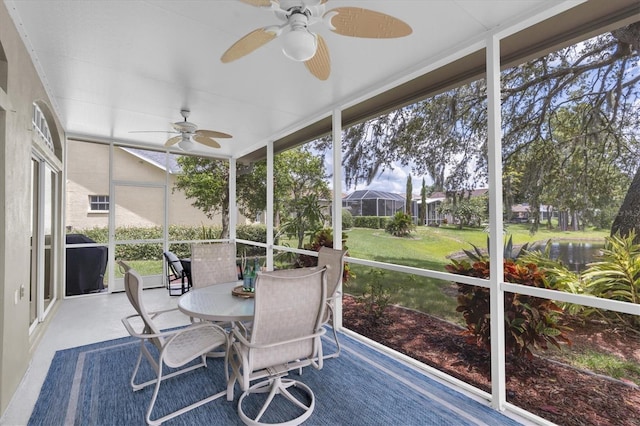 11418 Tee Time Cir, New Port Richey, FL 34654 - sunroom / solarium featuring ceiling fan, plenty of natural light, and outdoor dining space