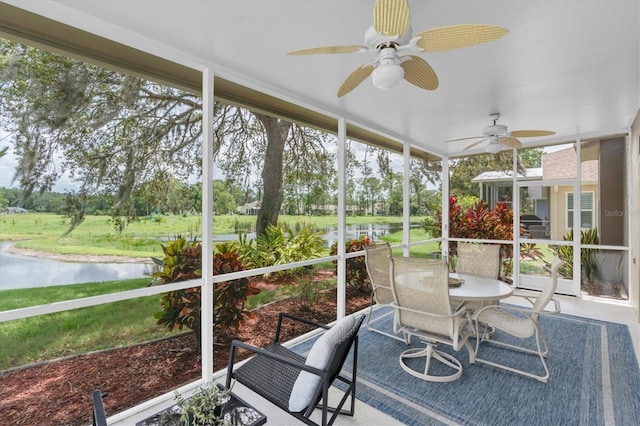 11418 Tee Time Cir, New Port Richey, FL 34654 - sunroom / solarium with a water view, a ceiling fan, outdoor dining space, and view of wooded area