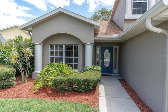 11418 Tee Time Cir, New Port Richey, FL 34654 - entrance to property with stucco siding and roof with shingles
