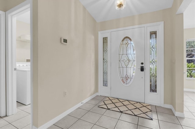 11418 Tee Time Cir, New Port Richey, FL 34654 - entrance foyer featuring washer / clothes dryer and light tile patterned floors