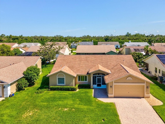 8401 Pavilion Dr, Hudson, FL 34667 - view of front of property with an attached garage, driveway, stucco siding, and a residential view