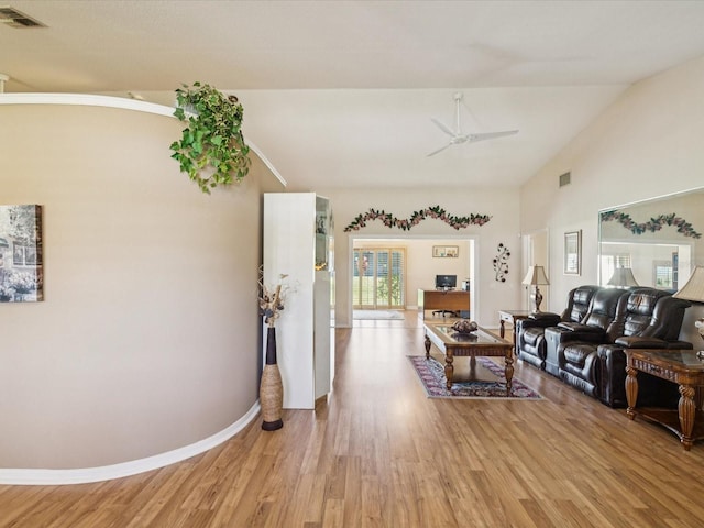 8401 Pavilion Dr, Hudson, FL 34667 - living room featuring light wood-style flooring, ceiling fan, and lofted ceiling
