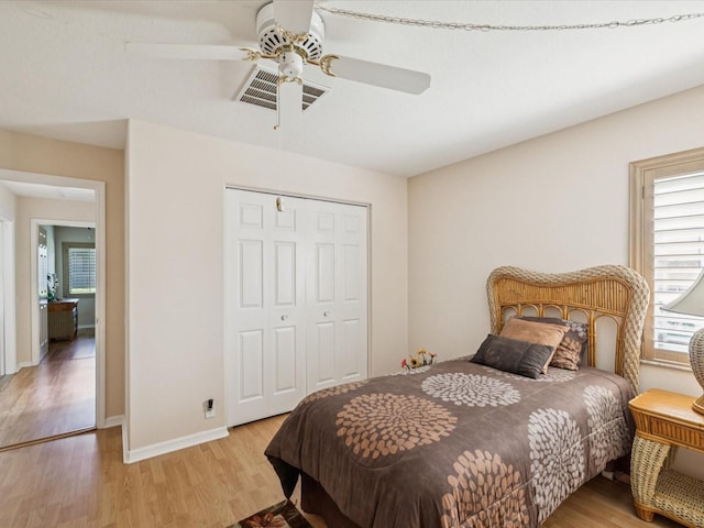 8401 Pavilion Dr, Hudson, FL 34667 - bedroom featuring light wood finished floors, a closet, and ceiling fan