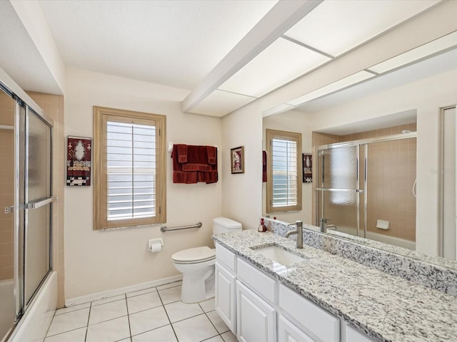 8401 Pavilion Dr, Hudson, FL 34667 - full bath featuring tile patterned floors, vanity, and bath / shower combo with glass door