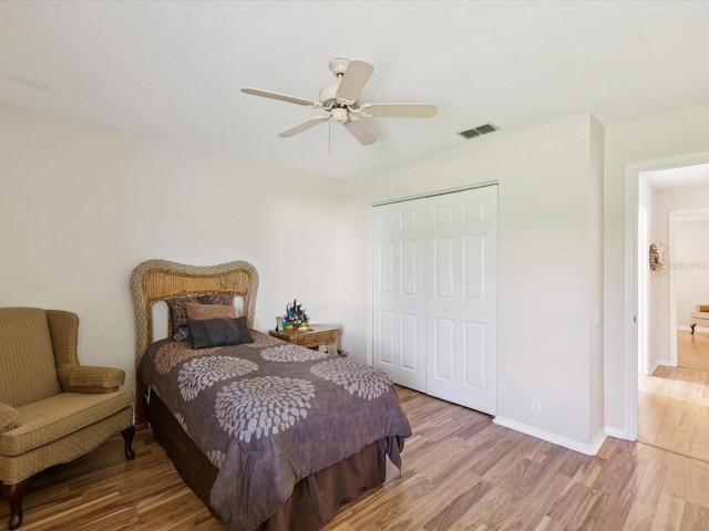 8401 Pavilion Dr, Hudson, FL 34667 - bedroom with wood finished floors, a closet, and ceiling fan