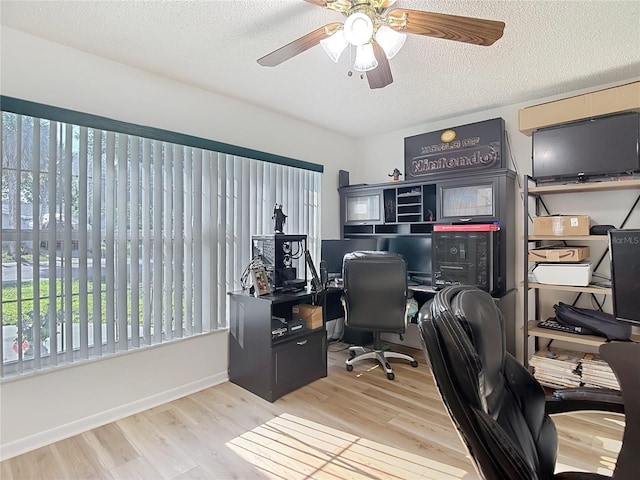 9425 Sterling Ln, Port Richey, FL 34668 - office with wood finished floors, a textured ceiling, and ceiling fan