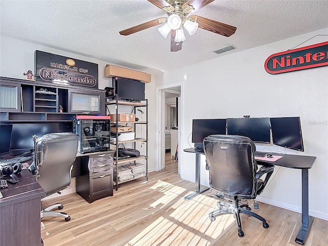 9425 Sterling Ln, Port Richey, FL 34668 - office with ceiling fan, wood finished floors, and a textured ceiling