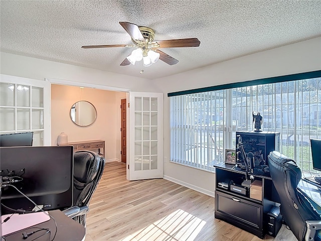 9425 Sterling Ln, Port Richey, FL 34668 - office with a ceiling fan, wood finished floors, and a textured ceiling