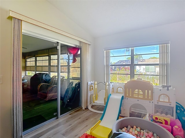 9425 Sterling Ln, Port Richey, FL 34668 - playroom with wood finished floors and vaulted ceiling
