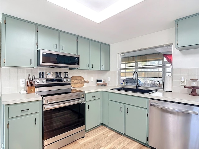 9425 Sterling Ln, Port Richey, FL 34668 - kitchen featuring appliances with stainless steel finishes, backsplash, and light countertops