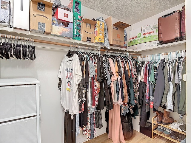 9425 Sterling Ln, Port Richey, FL 34668 - spacious closet featuring wood finished floors