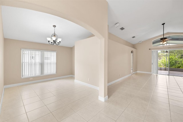 252 Arbor Woods Cir, Oldsmar, FL 34677 - spare room with arched walkways, vaulted ceiling, light tile patterned floors, a chandelier, and a ceiling fan