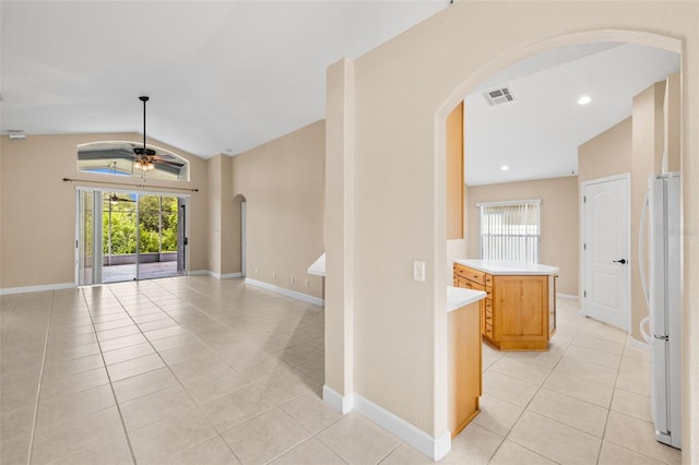 252 Arbor Woods Cir, Oldsmar, FL 34677 - spare room featuring arched walkways, lofted ceiling, light tile patterned floors, and ceiling fan