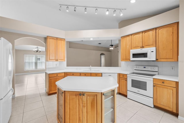 252 Arbor Woods Cir, Oldsmar, FL 34677 - kitchen featuring white appliances, arched walkways, light tile patterned floors, and light countertops
