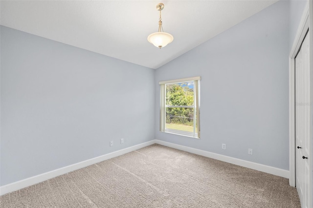 252 Arbor Woods Cir, Oldsmar, FL 34677 - spare room featuring vaulted ceiling and carpet flooring