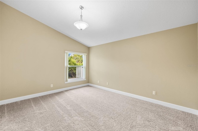 252 Arbor Woods Cir, Oldsmar, FL 34677 - carpeted empty room featuring vaulted ceiling and baseboards