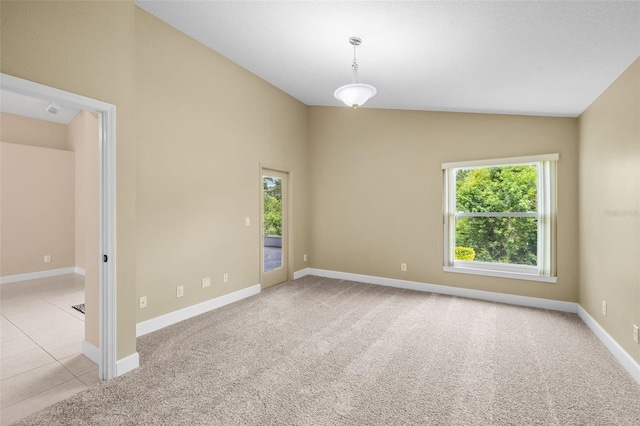 252 Arbor Woods Cir, Oldsmar, FL 34677 - spare room with lofted ceiling and light carpet