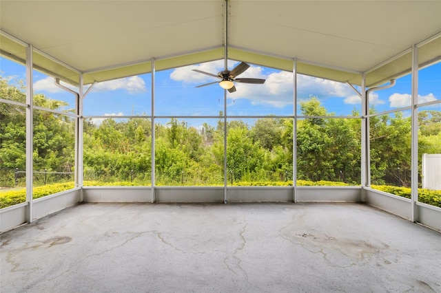 252 Arbor Woods Cir, Oldsmar, FL 34677 - unfurnished sunroom featuring ceiling fan and view of scattered trees