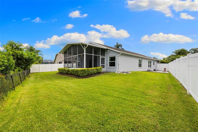 252 Arbor Woods Cir, Oldsmar, FL 34677 - rear view of property featuring a sunroom, a fenced backyard, and stucco siding