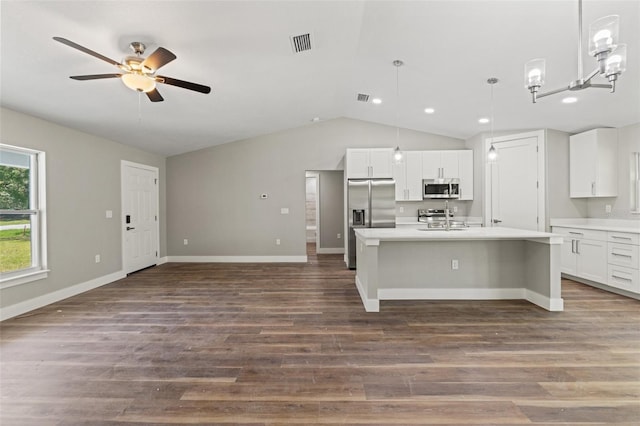 8782 N Sandree Dr, Citrus Springs, FL 34434 - kitchen with stainless steel appliances, lofted ceiling, ceiling fan, light countertops, and a center island with sink