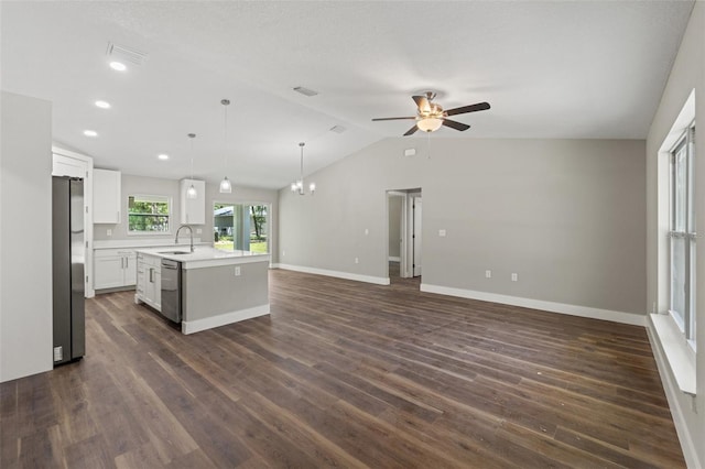 8782 N Sandree Dr, Citrus Springs, FL 34434 - kitchen featuring open floor plan, stainless steel appliances, light countertops, a center island with sink, and vaulted ceiling
