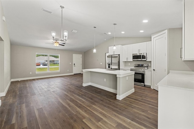 8782 N Sandree Dr, Citrus Springs, FL 34434 - kitchen featuring appliances with stainless steel finishes, lofted ceiling, dark wood-style floors, white cabinets, and open floor plan