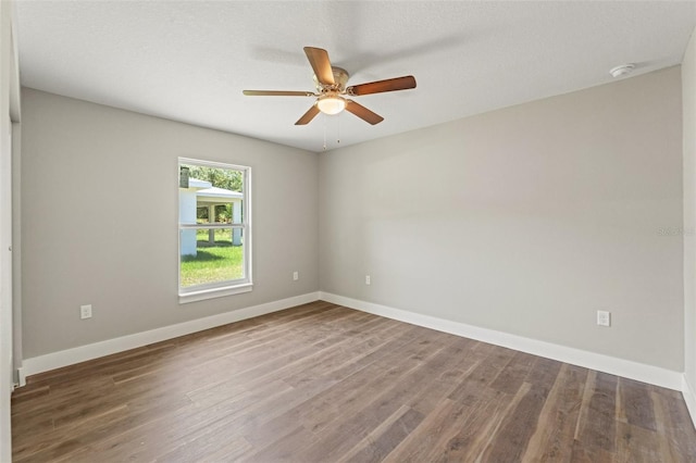 8782 N Sandree Dr, Citrus Springs, FL 34434 - unfurnished room with wood finished floors, a ceiling fan, and a smoke detector