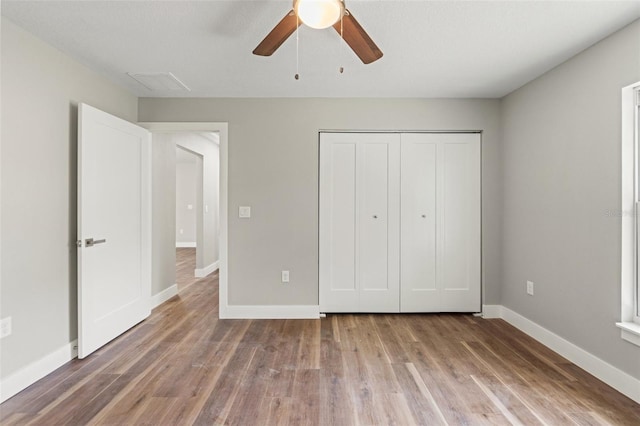 8782 N Sandree Dr, Citrus Springs, FL 34434 - unfurnished bedroom with wood finished floors, a closet, and ceiling fan