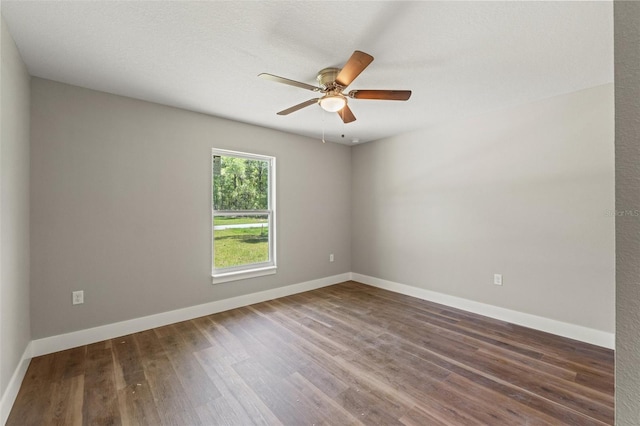 8782 N Sandree Dr, Citrus Springs, FL 34434 - empty room with wood finished floors and a ceiling fan