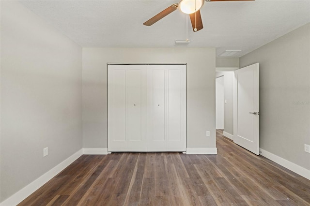 8782 N Sandree Dr, Citrus Springs, FL 34434 - unfurnished bedroom with wood finished floors, a closet, and a ceiling fan
