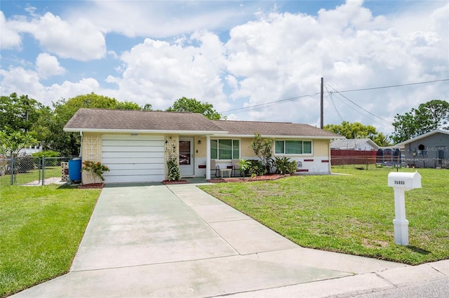 10600 Oleander Dr, Port Richey, FL 34668 - ranch-style home with driveway and an attached garage