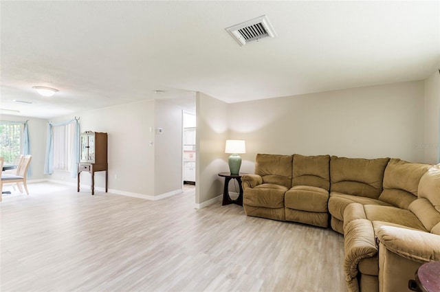 10600 Oleander Dr, Port Richey, FL 34668 - living room featuring light wood-type flooring