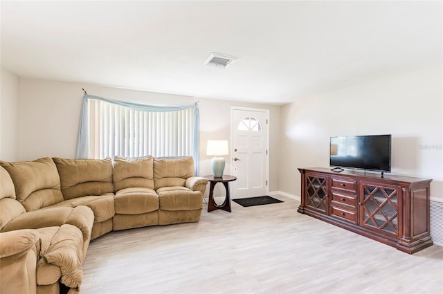 10600 Oleander Dr, Port Richey, FL 34668 - living room with wood finished floors and baseboards